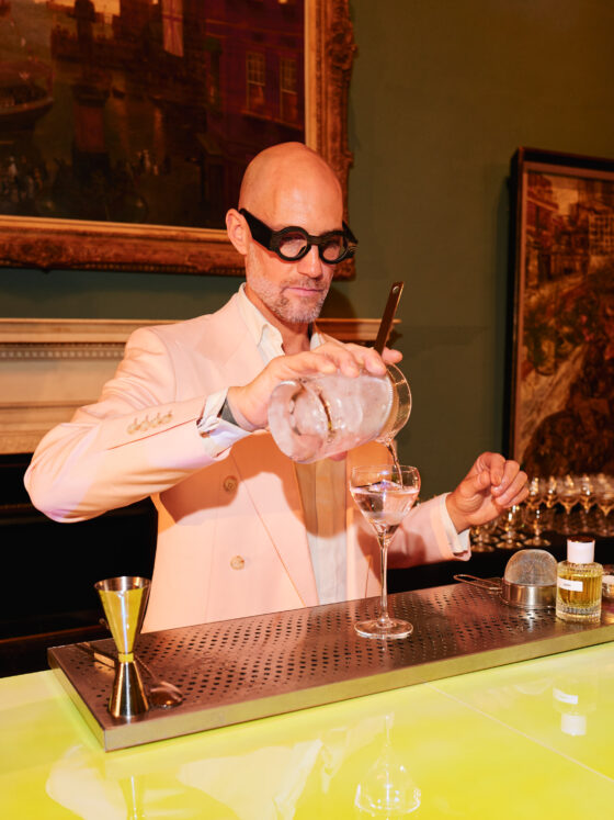 Expert mixologist preparing a signature luxury cocktail at a Philoxenia Events private bar in London