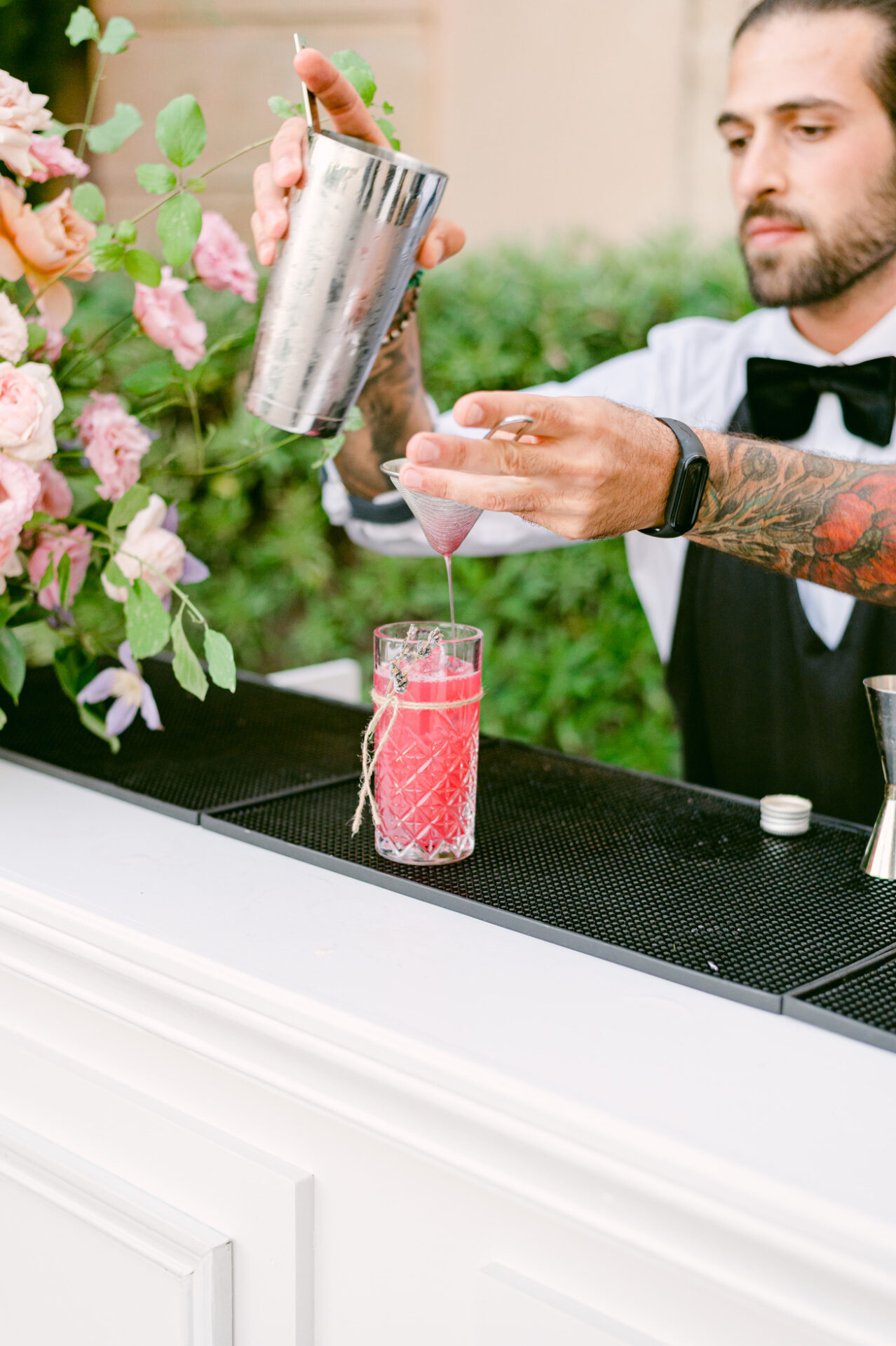 Philoxenia Events mixologist preparing cocktails at a private event in France for an American client