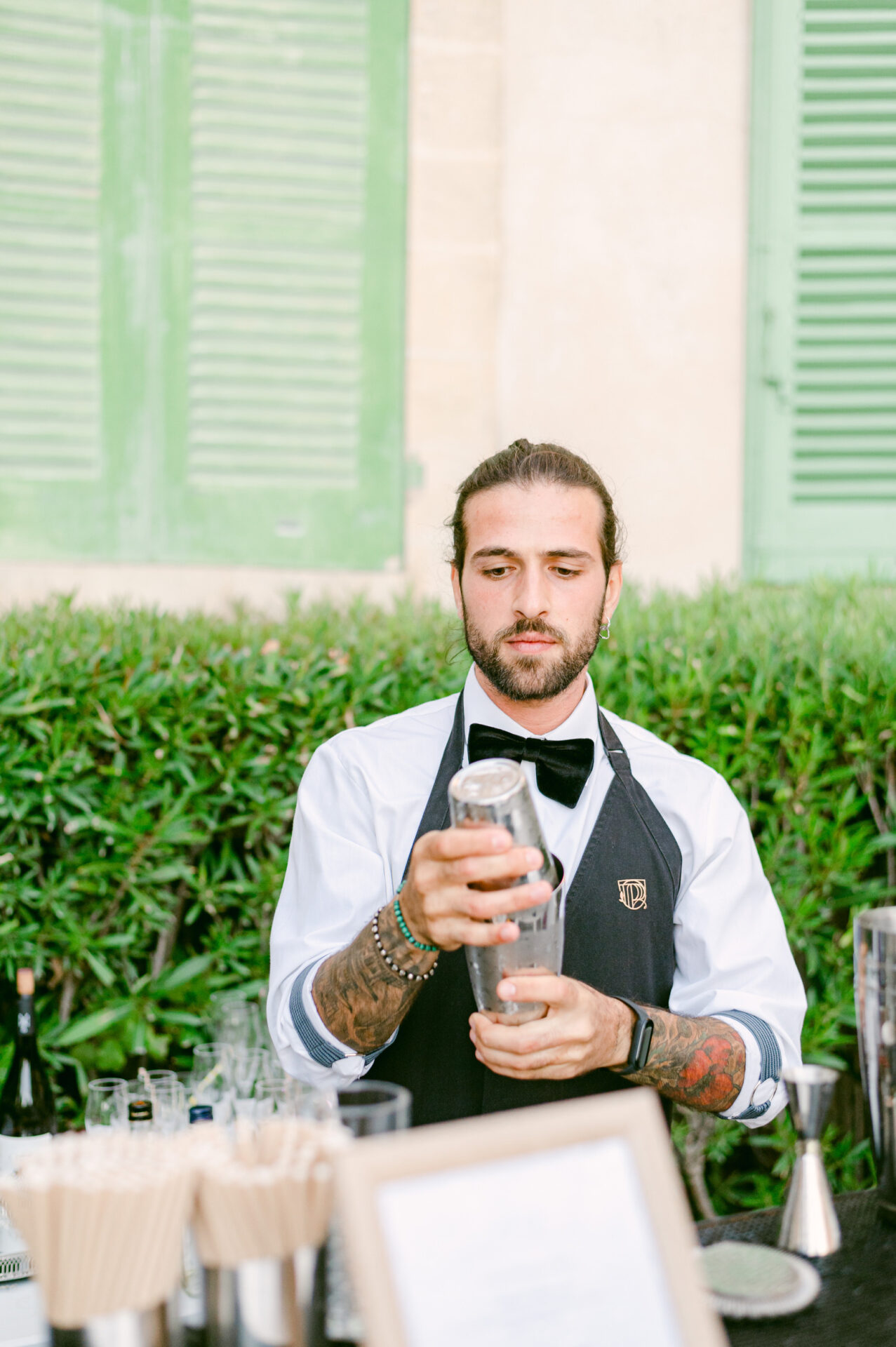 Professional mixologist from Philoxenia Events London creating a bespoke signature cocktail for American couple Jeff and Lisenda’s luxury wedding at Château de Tourreau in Provence, France